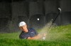Bryson DeChambeau follows his shot out of a bunker onto the 18th green of the Silverado Resort North Course during the first round of the Safeway Open PGA golf tournament Thursday, Sept. 26, 2019, in Napa, Calif. (AP Photo/Eric Risberg)
