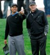 FILE - In this Feb. 20, 2007 file photo, Tiger Woods uses his putter to indicate a point of interest to coach Hank Haney, right, during a practice session for the World Golf Championships Accenture Match Play Championship in Marana, Ariz. Swing coach Haney has been suspended on Thursday, May 30, 2019, from the SiriusXM PGA Tour Radio channel because of saying on his show that a Korean would probably win the U.S. Women's Open and that he couldn't name six players on the LPGA Tour. Haney, who coached Woods for six of his majors from 2004 to 2010, apologized on Twitter. (AP Photo/Lenny Ignelz/File)