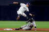 San Diego Padres second baseman Luis Urias, above, leaps over Colorado Rockies' Garrett Hampson who is caught stealing second base during the first inning of a baseball game Monday, April 15, 2019, in San Diego. (AP Photo/Gregory Bull)