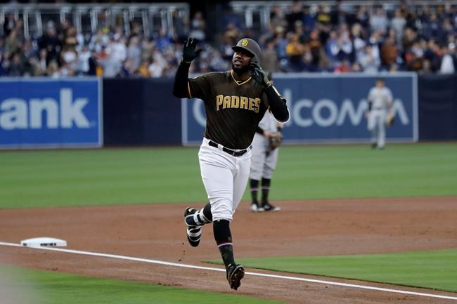 San Diego Padres' Franmil Reyes reacts after hitting a home run during the first inning of a baseball game against the Pittsburgh Pirates, Friday, May 17, 2019, in San Diego. (AP Photo/Gregory Bull)