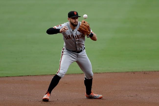 San Francisco Giants third baseman Evan Longoria bobbles the ball while fielding a ground ball hit for a single by San Diego Padres' Hunter Renfroe during the second inning of a baseball game Wednesday, July 3, 2019, in San Diego. (AP Photo/Gregory Bull)