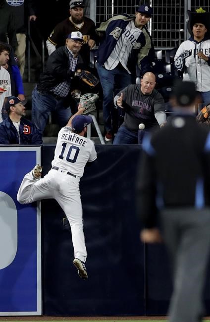 San Diego Padres left fielder Hunter Renfroe can't reach a home run by Arizona Diamondbacks' John Ryan Murphy during the fifth inning of a baseball game Tuesday, May 21, 2019, in San Diego. (AP Photo/Gregory Bull)