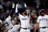 San Diego Padres' Manny Machado, celebrates with Fernando Tatis Jr. (23) and Eric Hosmer, right, after hitting a three-run home run during the second inning against the St. Louis Cardinals in a baseball game Saturday, June 29, 2019, in San Diego. (AP Photo/Gregory Bull)