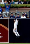 San Diego Padres center fielder Manuel Margot makes the catch over the wall for the out on New York Mets' Pete Alonso during the sixth inning of a baseball game, Wednesday, May 8, 2019, in San Diego. (AP Photo/Gregory Bull)