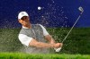 Tiger Woods hits out of a bunker on the 16th hole of the South Course at Torrey Pines Golf Course during the first round of the Farmers Insurance golf tournament Thursday, Jan. 24, 2019, in San Diego. (AP Photo/Gregory Bull)