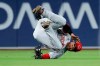 Cincinnati Reds left fielder Matt Kemp falls after making the catch for the out on San Diego Padres' Franmil Reyes during the fifth inning of a baseball game Thursday, April 18, 2019, in San Diego. (AP Photo/Gregory Bull)
