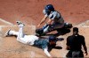 The San Diego Padres' Wil Myers, bottom left, scores off a sacrifice fly by Francisco Mejia as Los Angeles Dodgers catcher Austin Barnes, top, is late with the tag during the fourth inning of a baseball game Sunday, May 5, 2019, in San Diego. (AP Photo/Gregory Bull)