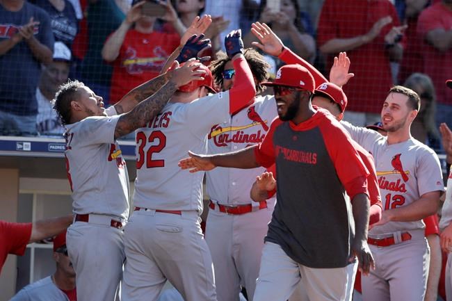 St. Louis Cardinals' Matt Wieters, second from left, celebrates with teammates after hitting a two-run home run during the eleventh inning of a baseball game against the San Diego Padres, Sunday, June 30, 2019, in San Diego. (AP Photo/Gregory Bull)