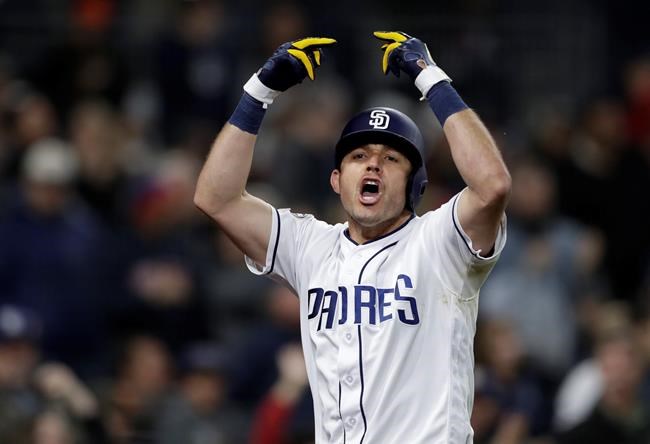 San Diego Padres' Ian Kinsler celebrates after hitting a three-run home run during the sixth inning of the team's baseball game against the Pittsburgh Pirates, Thursday, May 16, 2019, in San Diego. (AP Photo/Gregory Bull)