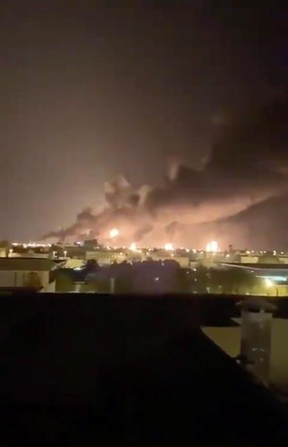 Smoke fills the sky at the Abqaiq oil processing facility on Saturday, Sept. 14, 2019 in Saudi Arabia. Drones claimed by Yemen's Houthi rebels attacked the world's largest oil processing facility in Saudi Arabia and a major oilfield operated by Saudi Aramco early Saturday, sparking a huge fire at a processor crucial to global energy supplies. (Validated UGC via AP)