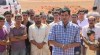In this image made from video, Abdullah Kurdi, foreground, the Syrian man who survived a capsizing during a desperate voyage from Turkey to Greece, speaks to reporters from a graveyard after burying his wife and two sons in their hometown of Kobani, the Syrian Kurdish region they fled, on Friday, Sept. 4, 2015. The haunting image of the man's 3-year-old son, Aylan Kurdi, washed up on Turkish beach focused the world's attention on the wave of migration fueled by war and deprivation. Aylan drowned along with his 5-year-old brother Galip and his mother, Rehan while trying to reach the island of Kos. (AP Photo via AP video)