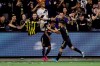 Los Angeles FC's Latif Blessing, center left, celebrates after scoring with Diego Rossi during the first half of an MLS soccer match against Los Angeles Galaxy, Sunday, Aug. 25, 2019, in Los Angeles. (AP Photo/Marcio Jose Sanchez)