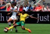 United States forward Christen Press (23) steals the ball from South Africa forward Rhoda Mulaudzi (22) in the first half of an international friendly soccer match in Santa Clara, Calif., Sunday, May 12, 2019. (AP Photo/Nic Coury)