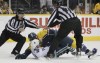Mark Humphrey / The Associated Press
Linesmen Vaughan Rody, left, and Tim Nowak, right, break up a fight between Vancouver Canucks right wing Alex Burrows, bottom, and Nashville Predators defenseman Shea Weber in the second period of an NHL hockey game.