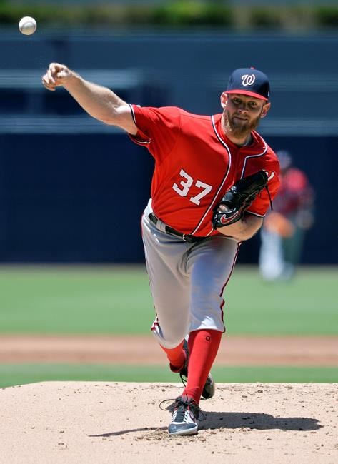 Washington Nationals starting pitcher Stephen Strasburg works against a San Diego Padres batter during the first inning of a baseball game, Sunday, June 9, 2019, in San Diego. (AP Photo/Orlando Ramirez)