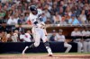 San Diego Padres' Fernando Tatis Jr. hits a two-run home run during the fifth inning of a baseball game against the San Francisco Giants Saturday, July 27, 2019, in San Diego. (AP Photo/Orlando Ramirez)