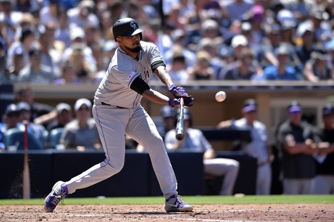 Colorado Rockies' German Marquez hits a RBI single during the sixth inning of the baseball game against the San Diego Padres Sunday, Aug. 11, 2019, in San Diego. (AP Photo/Orlando Ramirez)