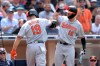 Baltimore Orioles' Chris Davis (19) is congratulated by Stevie Wilkerson (12) after hitting a home run during the eighth inning of a baseball game against the San Diego Padres Tuesday, July 30, 2019, in San Diego. (AP Photo/Orlando Ramirez)