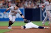 San Diego Padres' Greg Garcia, center, is caught stealing as San Francisco Giants second baseman Joe Panik, left, applies the tag during the sixth inning of a baseball game Saturday, July 27, 2019, in San Diego. (AP Photo/Orlando Ramirez)