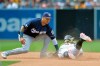 San Diego Padres' Fernando Tatis Jr. is caught stealing second base as Milwaukee Brewers shortstop Orlando Arcia applies the tag during the sixth inning of a baseball game Wednesday, June 19, 2019, in San Diego. (AP Photo/Orlando Ramirez)
