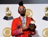 Fantastic Negrito poses in the press room with the award for best contemporary blues album for 