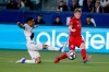 LA Galaxy midfielder Efrain Alvarez, left, and Toronto FC midfielder Jacob Shaffelburg, vie for the ball during the first half of an MLS soccer match in Carson, Calif., Thursday, July 4, 2019. (AP Photo/Ringo H.W. Chiu)