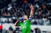 Seattle Sounders midfielder Nicolas Lodeiro celebrates his goal while holding his shoe during the first half of the team's MLS soccer Western Conference final against Los Angeles FC, Tuesday, Oct. 29, 2019, in Los Angeles. (AP Photo/Ringo H.W. Chiu)