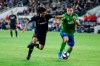 Los Angeles FC forward Carlos Vela, left, vies against Seattle Sounders forward Jordan Morris during the second half of the MLS soccer Western Conference final Tuesday, Oct. 29, 2019, in Los Angeles. The Sounders won 3-1. (AP Photo/Ringo H.W. Chiu)