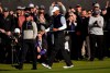Tiger Woods reacts as the gallery cheers after making birdie on the ninth hole as second round play continues during the Genesis Open golf tournament at Riviera Country Club on Saturday, Feb. 16, 2019, in the Pacific Palisades area of Los Angeles. (AP Photo/Ryan Kang)
