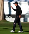 Adam Scott, of Australia, waves to the crowd after making a birdie putt on the eighth hole as third-round play continues during the Genesis Open golf tournament at Riviera Country Club on Sunday, Feb. 17, 2019, in the Pacific Palisades area of Los Angeles. (AP Photo/Ryan Kang)