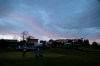 Players and spectators walk to the clubhouse as the sun sets as viewed from the ninth green during the first round of the Genesis Open golf tournament at Riviera Country Club Thursday, Feb. 14, 2019, in the Pacific Palisades area of Los Angeles. (AP Photo/Ryan Kang)