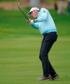 Matt Kuchar hits his approach shot on the 17th hole as the first round of play continues at the Genesis Open golf tournament at Riviera Country Club on Friday, Feb. 15, 2019, in the Pacific Palisades area of Los Angeles. (AP Photo/Ryan Kang)
