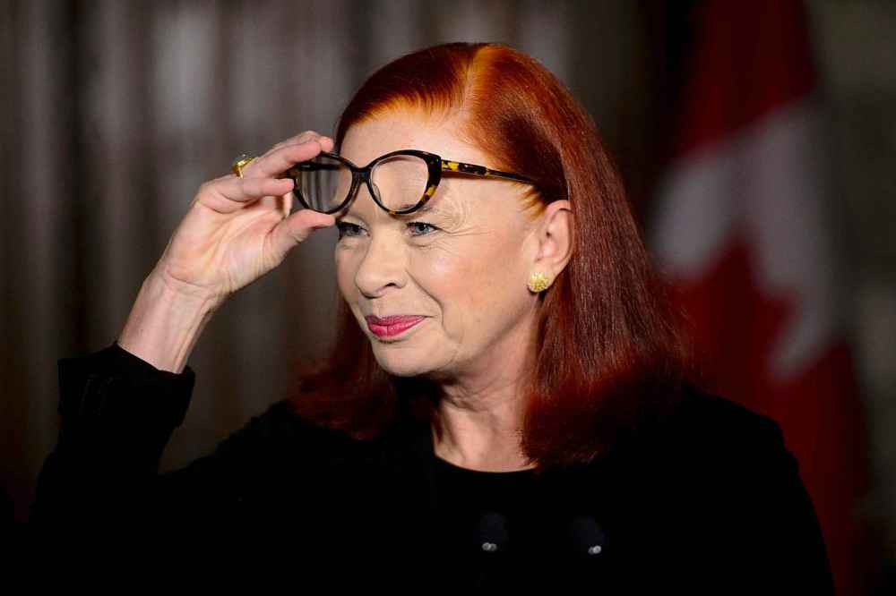 CP
Catherine Tait, looks on as Heritage Minister Melanie Joly announces that Tait is the new president and CEO of CBC/Radio-Canada during a press conference in the foyer of the House of Commons on Parliament Hill in Ottawa on Tuesday, April 3, 2018. THE CANADIAN PRESS/Sean Kilpatrick