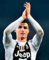 Juventus' Cristiano Ronaldo celebrate his team's victory in their Italian Serie A soccer match against Torino FC at the Olimpico stadium in Turin, Italy, Saturday Dec. 15, 2018 (Alessandro Di Marco/ANSA via AP)
