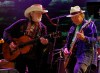 FILE - In this Sept. 22, 2012 file photo Neil Young, right, and Willie Nelson perform during the Farm Aid 2012 concert at Hersheypark Stadium in Hershey, Pa. Opponents of a proposed pipeline that would carry oil from Canada south to the Gulf Coast said Monday, Aug. 18, 2014 that Nelson and Young will headline a concert on Sept. 27 on a farm near Neligh in northeast Nebraska. (AP Photo/Jacqueline Larma, File)