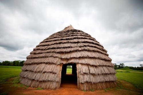 This undated photo provided by the Texas Historical Commission shows a grass house at a Native American historic site called Caddo Mounds before a twister hurled it into the distance with two other people still inside in Alto, Texas. Caddo Mounds was hosting a cultural event when the tornado struck. One person died and more than 20 were hurt. (Leah Brown/Texas Historical Commission via AP)