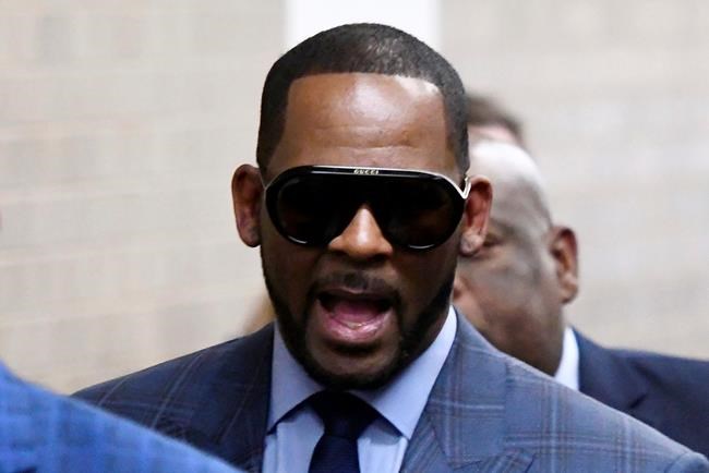 FILE - In this March 6, 2019 file photo, Musician R. Kelly arrives at the Daley Center for a hearing in his child support case at the Daley Center in Chicago. Kelly was charged last month with 10 counts of aggravated sexual abuse pertaining to four women, including three who were minors when the alleged abuse occurred. He has denied wrongdoing and pleaded not guilty to the charges. (AP Photo/Matt Marton, File)