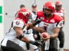 PAUL CHIASSON / THE CANADIAN PRESS
Stampeders quarterback Henry Burris hands off to running back Joffrey Reynolds in the Montreal game Monday. The Stamps lost 32-11 to the Alouettes.