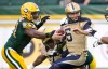 CP
Winnipeg Blue Bombers quarterback Drew Willy (5) is taken down by Edmonton Eskimos Odell Willis (41) during first half of Saturday's game in Edmonton. Jason Franson / THE CANADIAN PRESS FILES