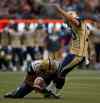 Darryl Dyck / The Canadian Press
Winnipeg Blue Bombers' Lirim Hajrullahu, right, kicks a field goal as quarterback Brian Brohm holds against the B.C. Lions in Vancouver, B.C., on Friday July 25. He kicked five field goals during the 23-6 victory.