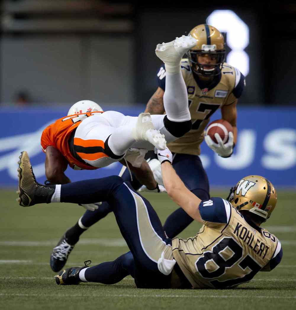Darryl Dyck / The Canadian Press
Nick Moore, 17, back, had seven catches for 99 yards in last week’s victory against B.C. but a foot injury means he will miss this week's game in Hamilton.