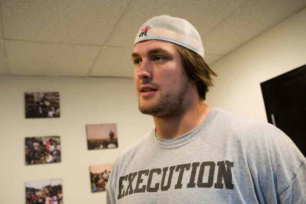BRETT GUNDLOCK / NATIONAL POST FILES
Halimton Tiger Cats player Simeon Rottier talks to media, Friday, July 9, 2010, in Toronto, Ont.