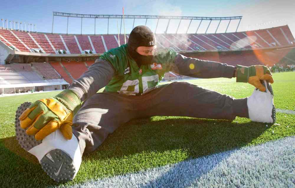 PAUL CHIASSON / THE CANADIAN PRESS FILES
Saskatchewan Roughriders defensive end Shomari Williams stretches during a Grey Cup practice Wednesday, November 24, 2010 in Edmonton.