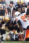 John Woods / The Canadian Press
Winnipeg Blue Bombers' Buck Pierce (4) lies on the ground after being hit hard by B.C. Lions' Solomon Elimimian in second half CFL action in Winnipeg, Thursday, July 28, 2011. Pierce was pulled from the game after this set of plays and replaced by Alex Brink (7).