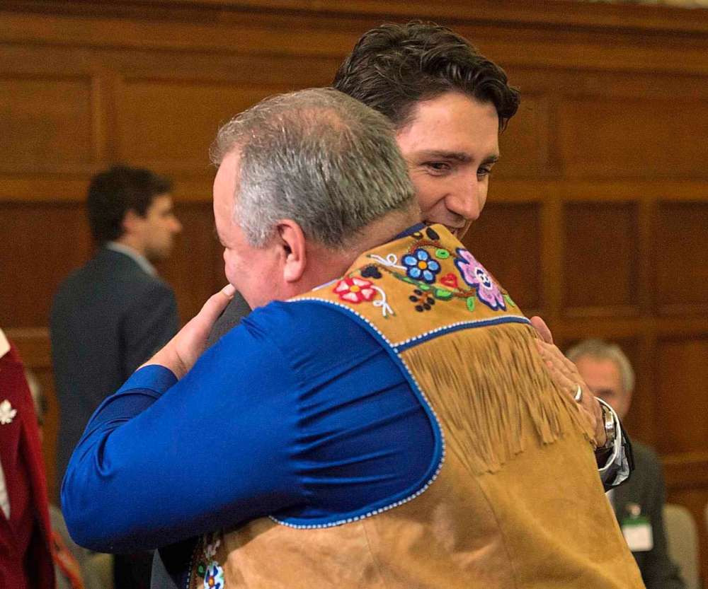 THE CANADIAN PRESS/Adrian Wyld
Indigenous and Northern Affairs Minister Carolyn Bennett looks on as Prime Minister Justin Trudeau greets Manitoba Metis President David Chartrand before a meeting with Indigenous leaders on Parliament Hill in Ottawa in 2016.