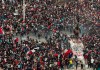 Police and demonstrators clash during an anti-government protest in Santiago, Chile, Monday, Nov. 4, 2019. Thousands of Chileans took to the streets again Monday to demand better social services, some clashing with police, as protesters demanded an end to economic inequality even as the government announced that weeks of demonstrations are hurting the country's economic growth. (AP Photo/Esteban Felix)