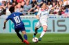 Lyon's Eugenie Le Sommer, right, challenges for the ball with Chelsea's So-Yun Ji, left, during their Women's Champions League semifinal soccer match in Decines, France, Sunday, April 21, 2019. (AP Photo/Laurent Cipriani)