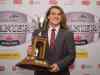 Jacques Boissinot / Canadian Press files
John Rush holds the Presidents Trophy as defensive player of the year during the 2015 CIS Awards gala.