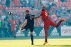 Sporting Kansas City defender Andreu Fontas (4) and Toronto FC forward Terrence Boyd (91) battle for the ball during first half MLS soccer action at BMO field in Toronto, Friday, June 7, 2019. THE CANADIAN PRESS/Cole Burston