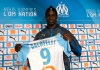 Olympique Marseille's new player Mario Balotelli poses with his new jersey during a press conference, at the club's headquarters of La Commanderie, in Marseille, southern France , Wednesday, Jan. 23, 2019. (AP Photo/Claude Paris)